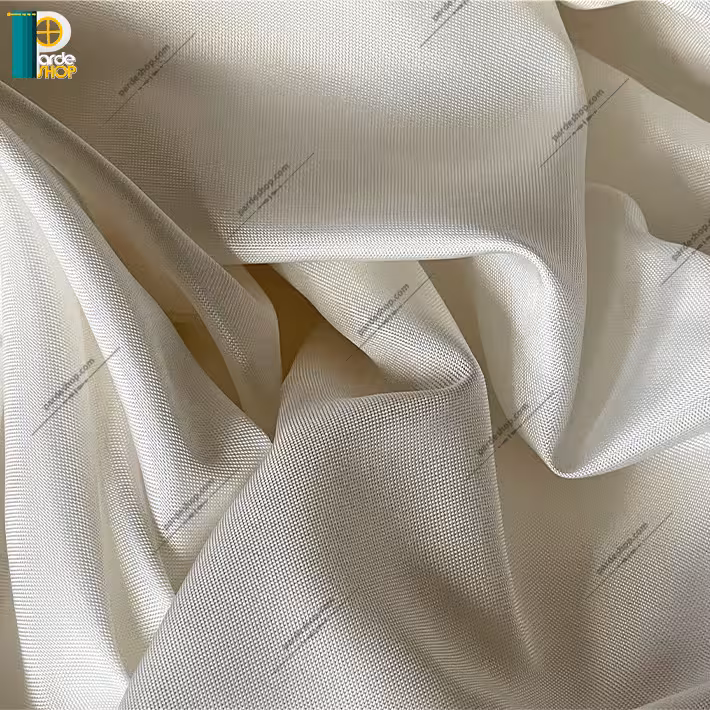 آستر پرده لطیف براق رنگ شیری روشن همراه دوخت و نوار