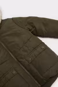 کاپشن نوزاد پسر خاکی دفکتو