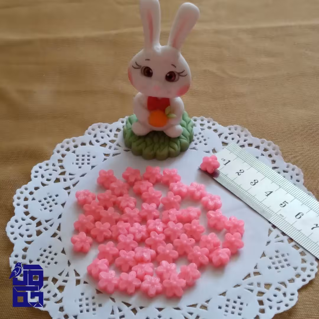 مهره طرح گل در دو رنگ صورتی و بنفش پک 10 عددی