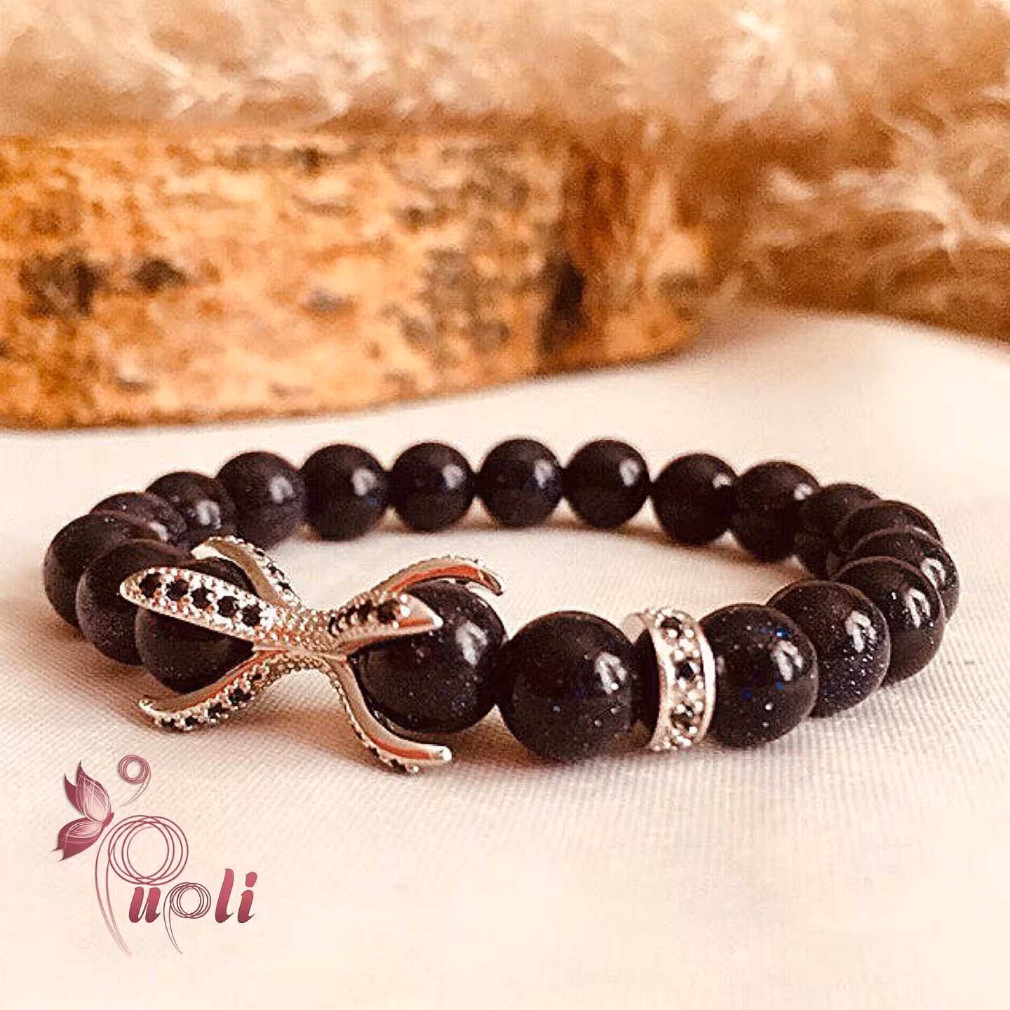 دستبند سنگ دلربا سرمه ای