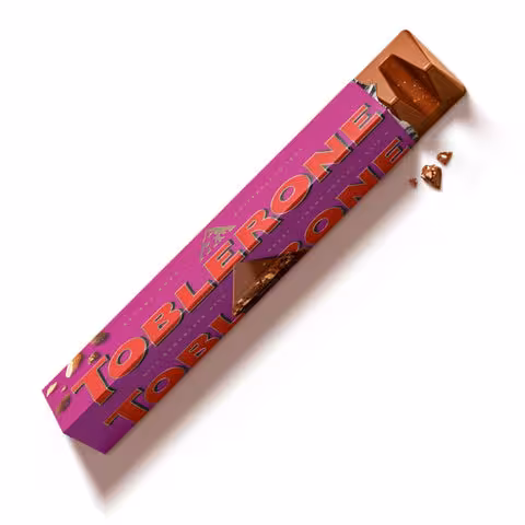 شکلات شیری تابلرون با مغز بادام ، عسل و کشمش 100 گرمی