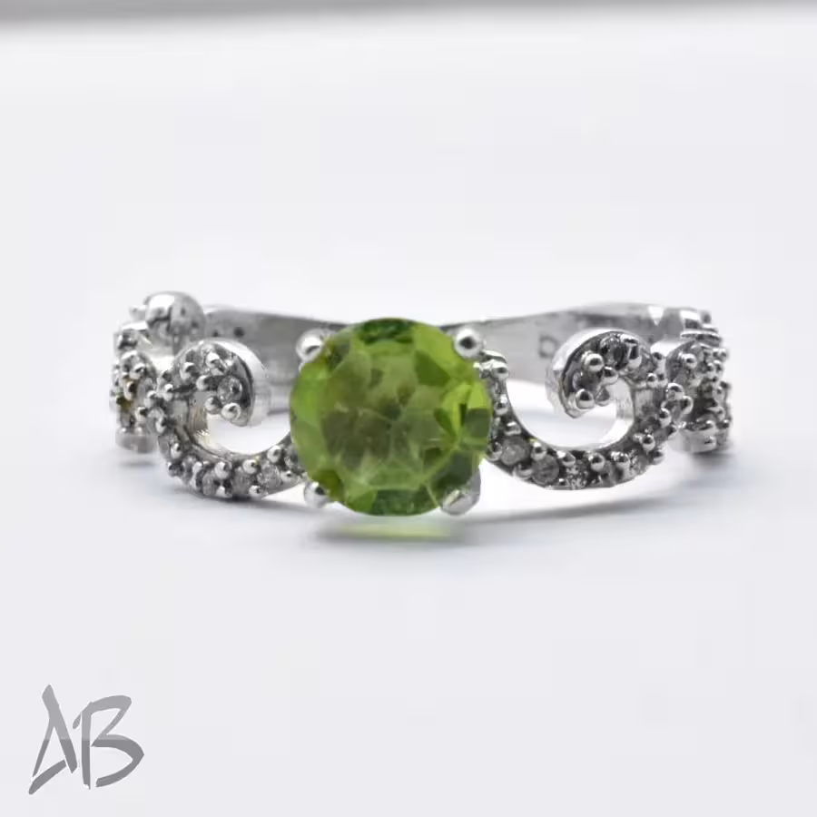 انگشتر نقره زنانه زبرجد معدنی، طراحی خاص و زیبای رکاب و عیار 925 آقابزرگ 324