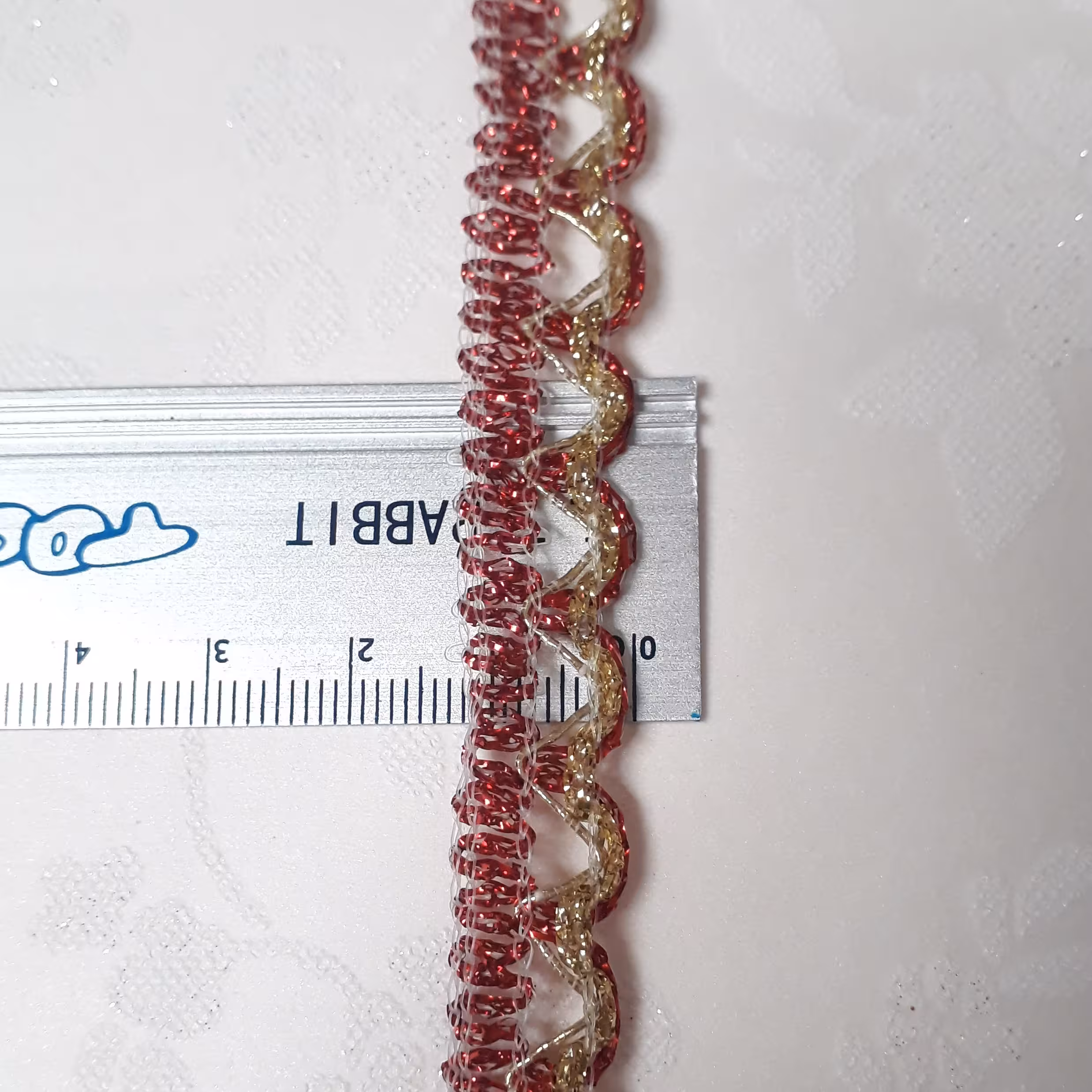 نواز تزیینی قرمز طلایی (قیمت برای یک متره)