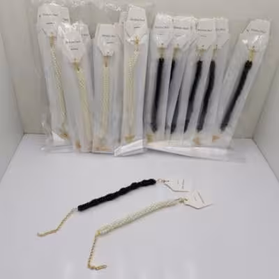 دستبند مروارید پیچیده سفید و مشکی