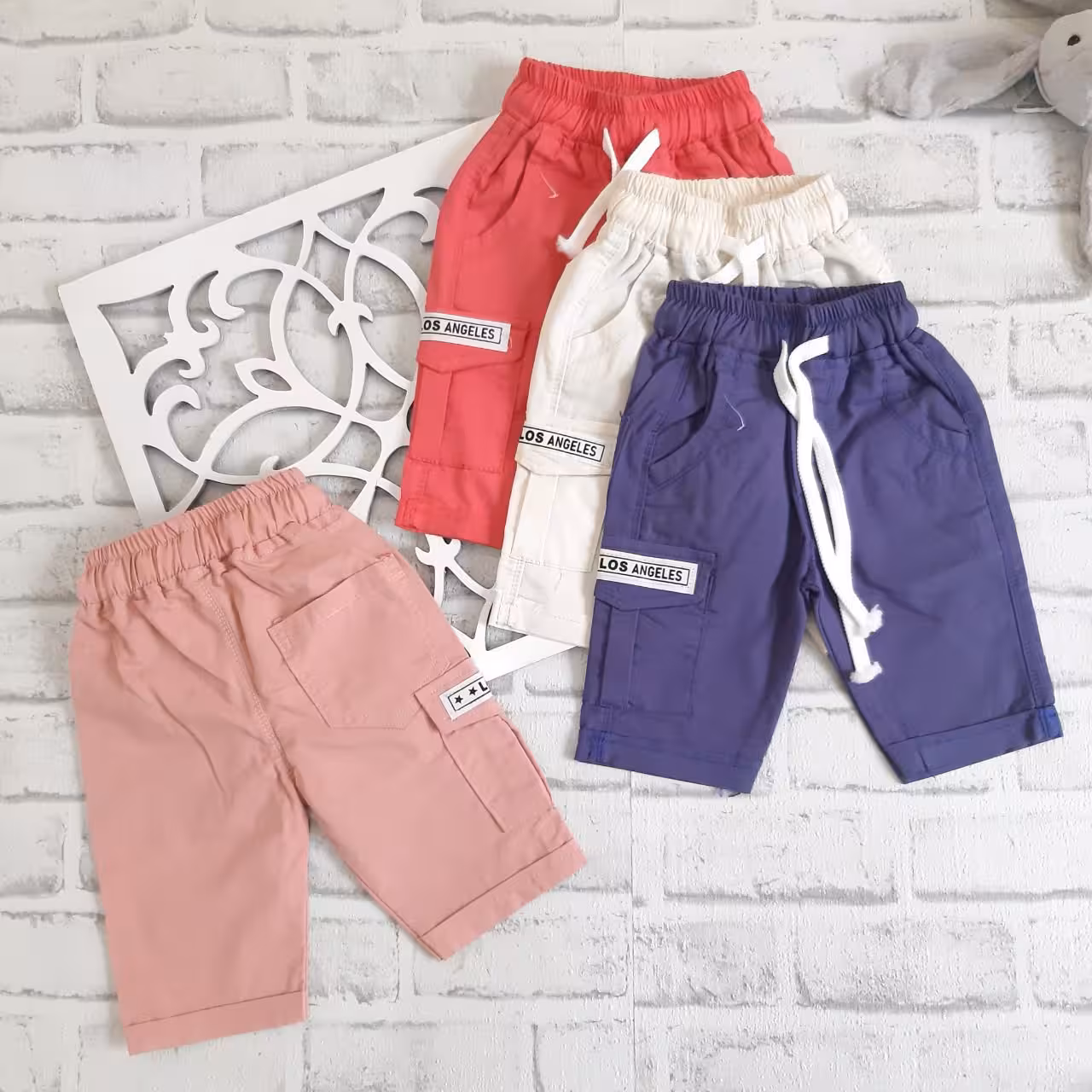 شلوارک کتان کاغذی بیرونی دخترانه و پسرانه سایز  55 کد 592n