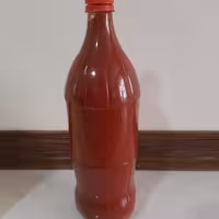 رب گوجه فرنگی خانگی بدون افزودنی های غیر مجاز  با طعمی خوب و رنگی بسیار عالی