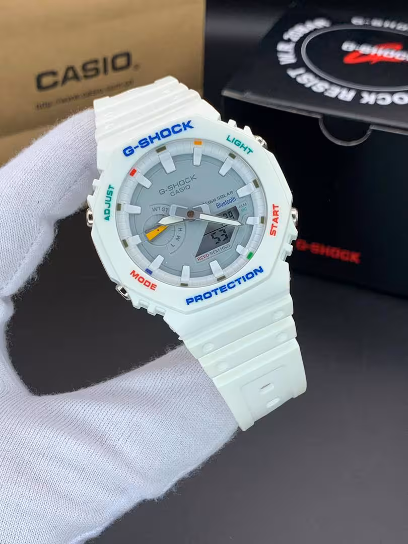 ساعت مچی کاسیو جیشاک مدل GA-2100 صفحه طوسی دور سفید بند سفید