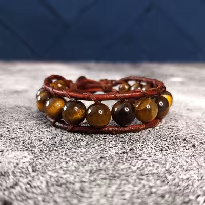 دستبند مدل سنگ چشم ببر دکمه ای 70