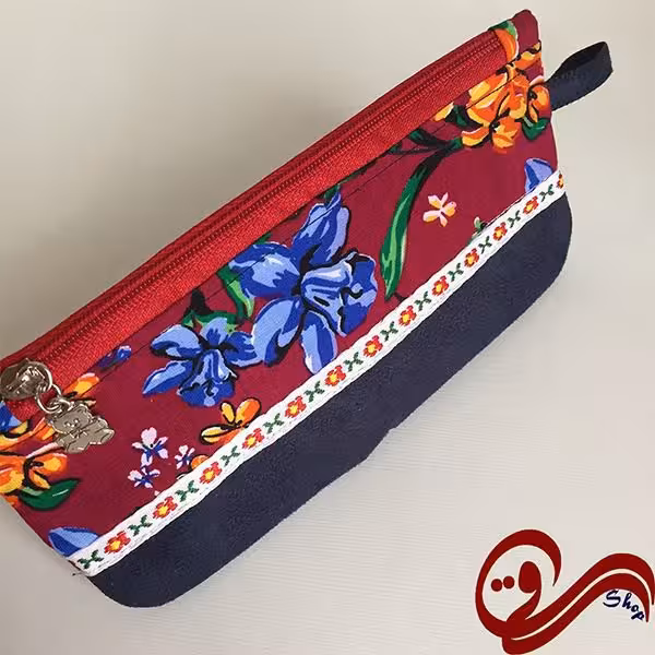 جامدادی پارچه ای زمینه سرمه ای گل نارنجی آبی