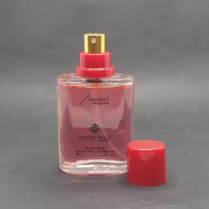 عطر جیبی وودی سنس باکارات رژ مردانه و زنانه حجم 30 میلی لیتر /