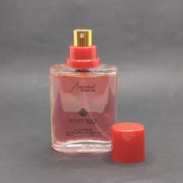 عطر جیبی وودی سنس باکارات رژ مردانه و زنانه حجم 30 میلی لیتر /