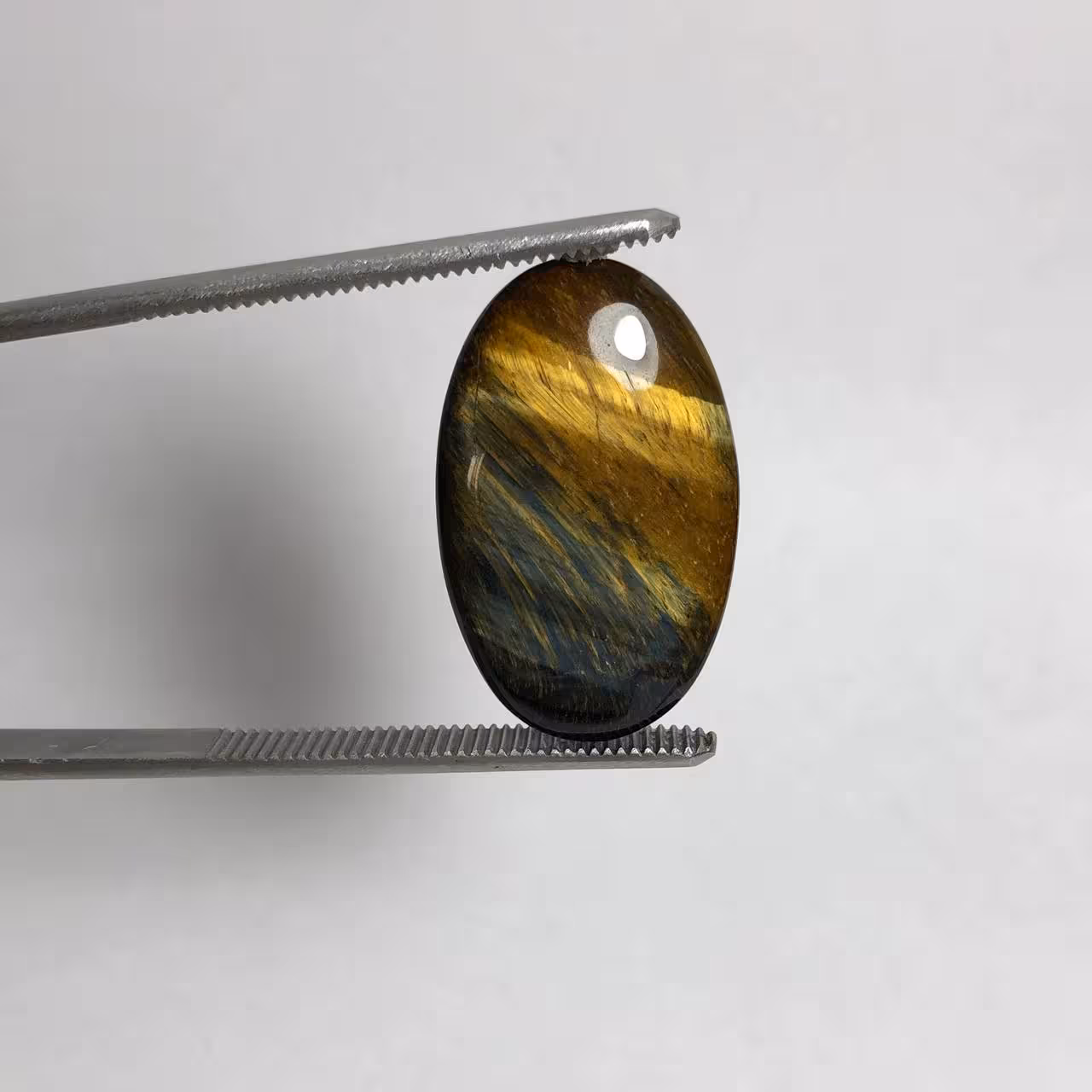 نگین چشم شاهین طبیعی بیضی با درخشش زیبا 240308