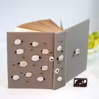 دفتر دستساز گلدوزی شده ببعی ناقلا BABAK PEN Handmade notebook embroidery Shaun the sheep