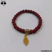 دستبند زرشکی با آویز برگ طلایی