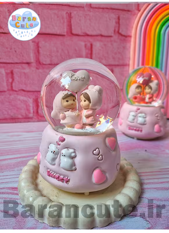 گوی موزیکال برفی چراغ دار (سایز متوسط) طرح عاشقانه صورتی پاستیلی