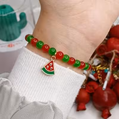 دستبند مروارید سنگی دو رنگ طرح انار و هندوانه یلدایی