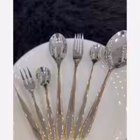 سرویس قاشق و چنگال نیمه طلایی یونیک دهانه اروپایی 24 نفره  استیل نگیر اصلی حکاکی جرمنی استیل 18/10 120 پارچه(طرح جدید)