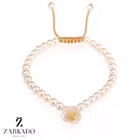 دستبند مرواریدی گل دار و گوی طلا