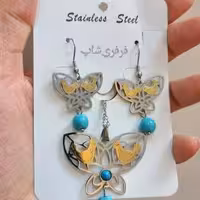 نیم ست مرغ آمین مدل گردنبند و گوشواره پروانه ای استیل