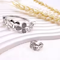 ست انگشتر و دستبند گلبرگ نقره ای استیل