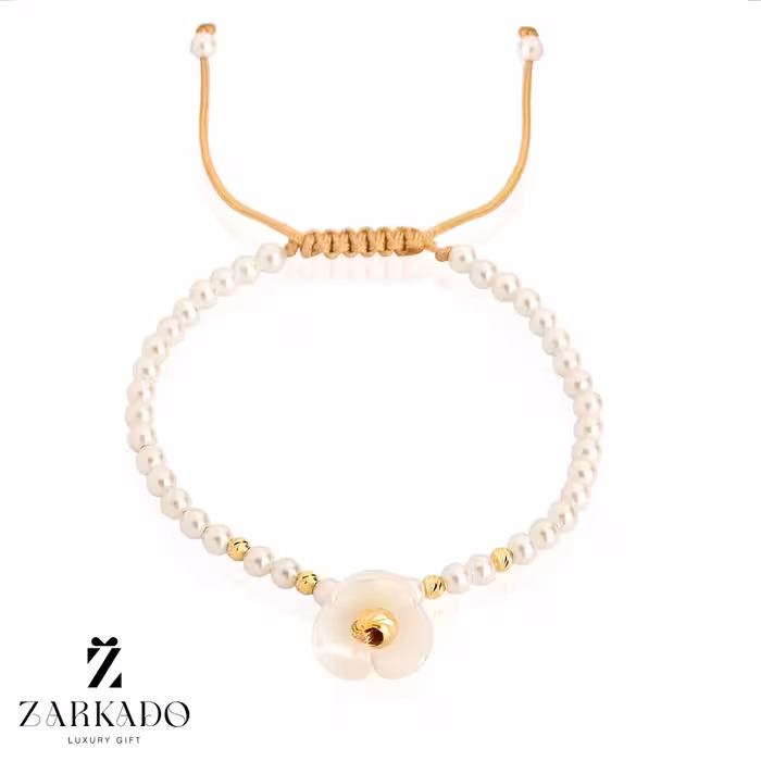 دستبند مرواریدی و گوی البرنادو طلا طرح گل نیلوفر آبی