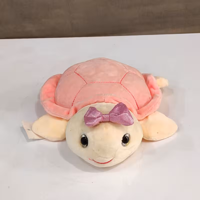 عروسک لاک پشت صورتی پاپیون به سر در کرمان