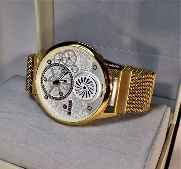 RADO jubilo WATCH رادو 2 موتوره زیر ثانیه به شکل پروانه ای با تاریخ روز شمار ** قاب وبند طلایی ** شیشه شفاف