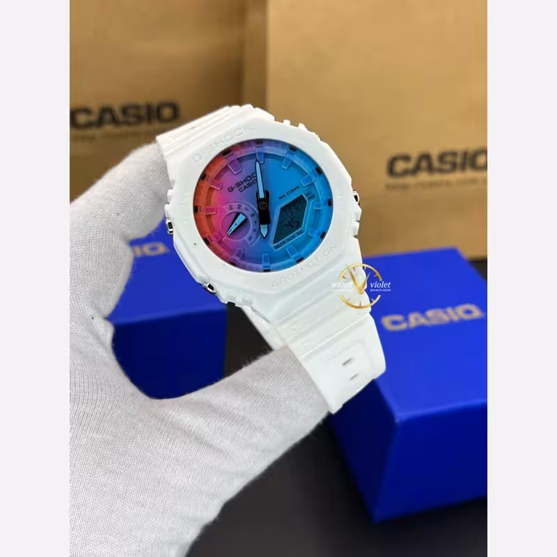 ساعت مچی جیشاک کاسیو صفحه و ایندکس رنگین کمانی بدنه و بند سفید