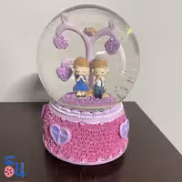 گوی شیشه ای صورتی موزیکال دختر و پسر