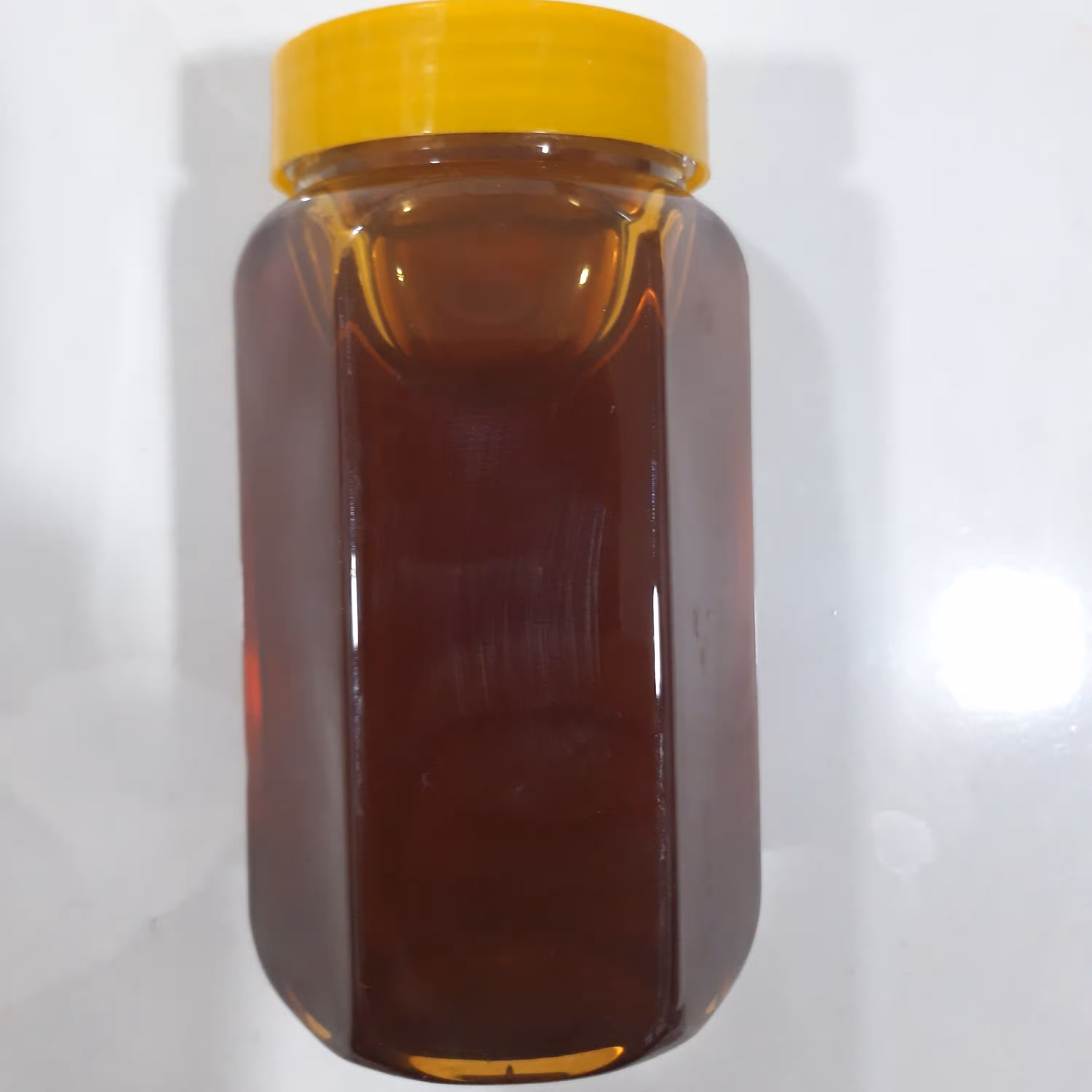 عسل گشنیز طبیعی در بسته بندی یک کیلویی