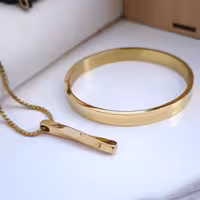 ست دستبند و گردنبند طلایی پسرانه استیل