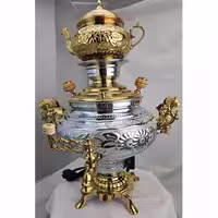 سماور برنجی با روکش طلایی و نقره‌ای و طرح گل و بوته برجسته
