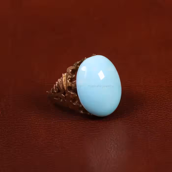 نگین فیروزه عجمی کد 29847 - جواهری مشاهیر