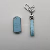 کاور ریموت مزدا 3 کلید تاشو طرح چرم با بند ست