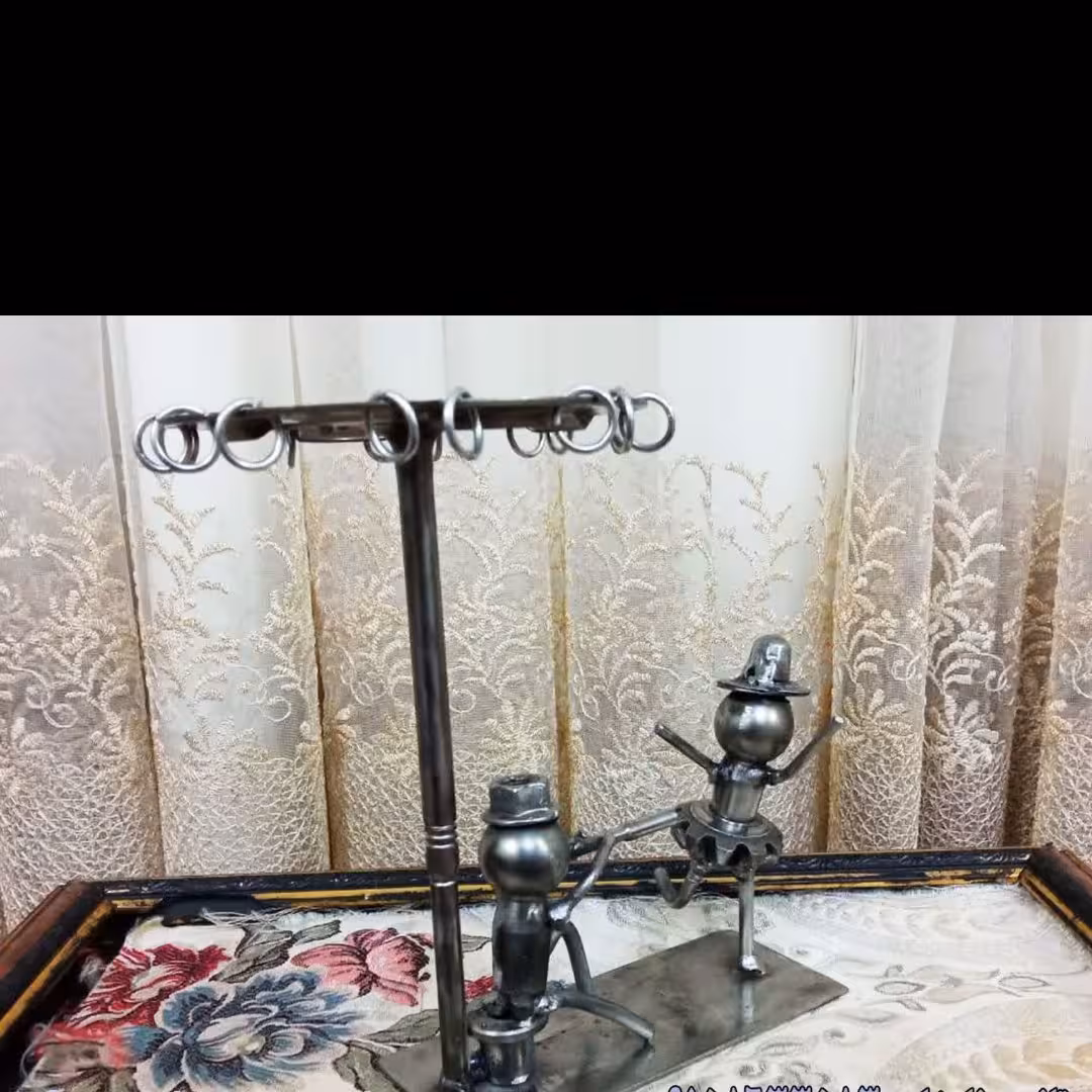 مجسمه فلزی مردساز نواز وعروس رقاص