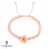 دستبند بافت گل مرواریدی و گوی طلا