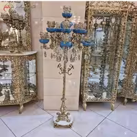 کنار سالنی برنزی با سر شاخه های آبی کریستالی، با کیفیت بالا و متریال ساخت درجه یک