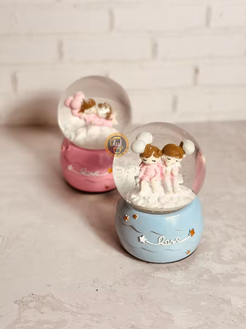 گوی موزیکال کوکی چرخان بزرگ طرح دختر و پسر برفی کد 7591