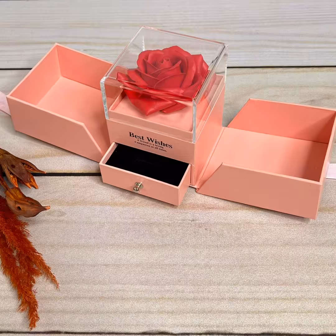باکس هدیه سورپرایزی ربان دار صورتی دارای گل مصنوعی