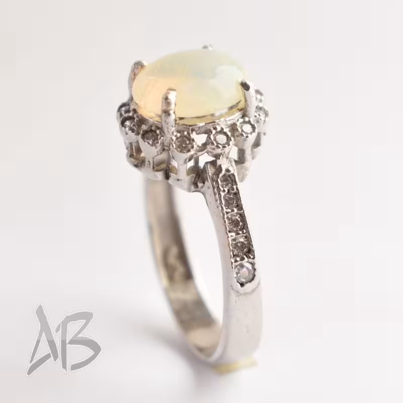 انگشتر نقره زنانه اپال سنگ جواهری و معدنی و اصل عیار 925  آقابزرگ 