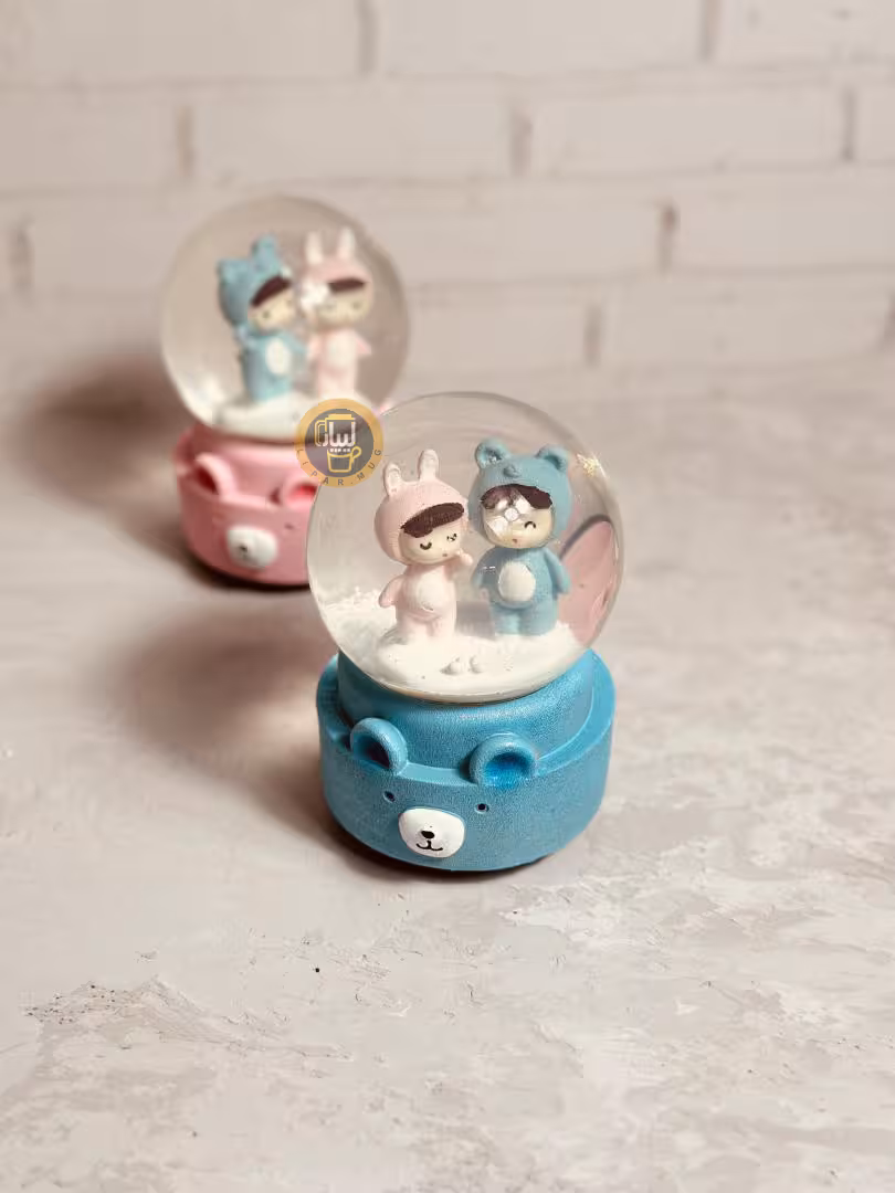 گوی موزیکال کوکی چرخان بزرگ طرح عروسکی دختر و پسر کد 7603