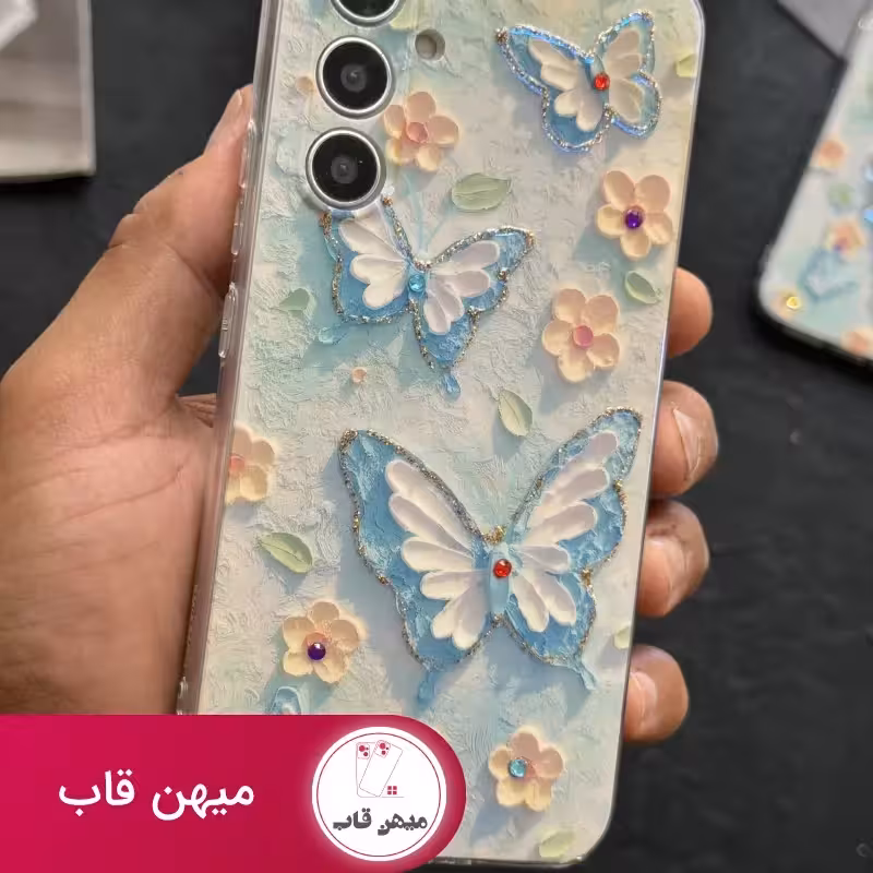 قاب موبایل آیفون – سامسونگ گل بابونه و پروانه آبرنگی محافظ لنزدار - کد (101418)