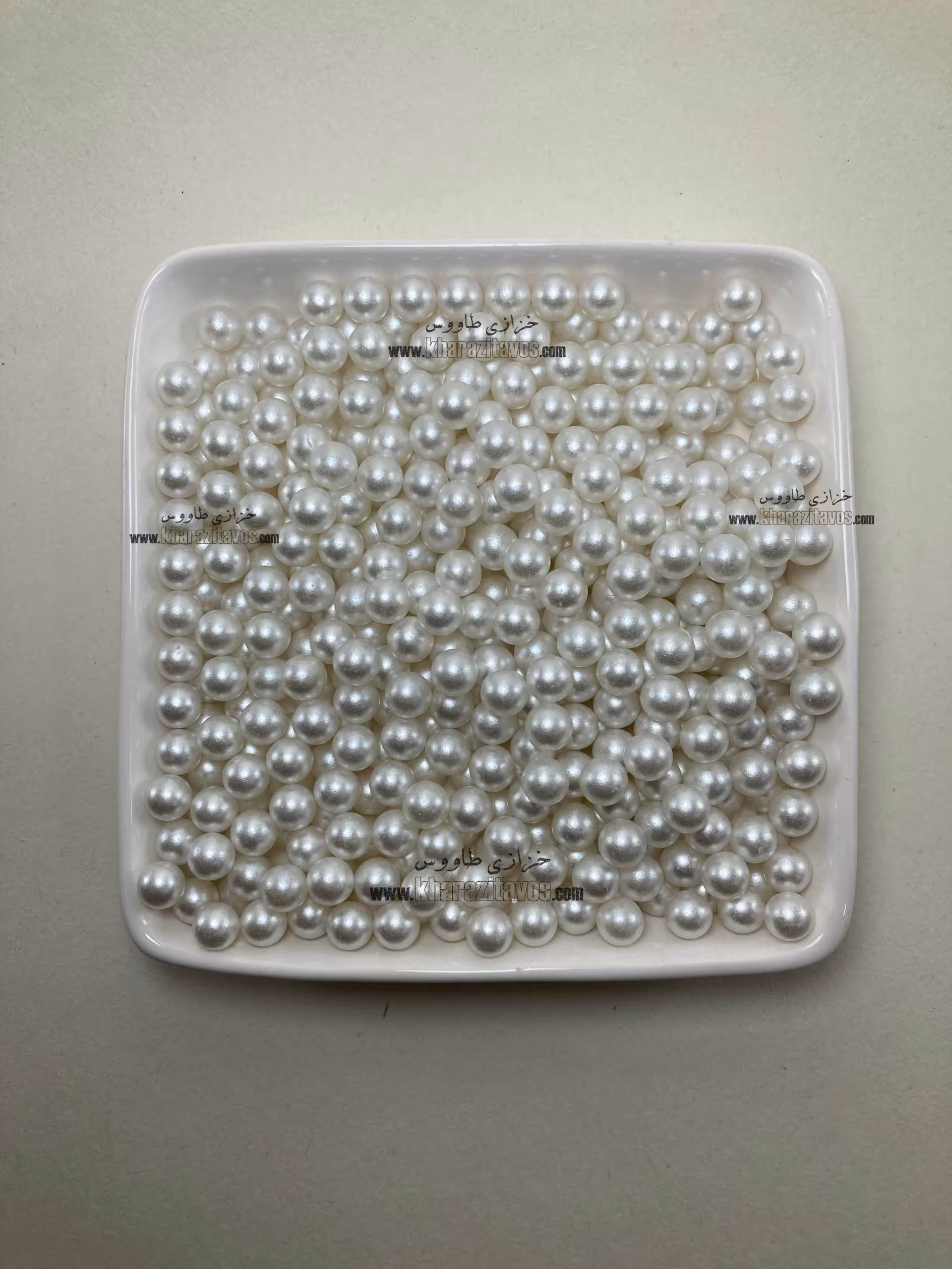 مروارید پانچی سایز 8 بسته 100 گرمی ( سفید off white )