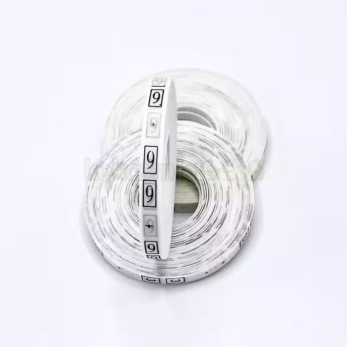 مارک سایز لباس شماره 9 رنگ سفید ( یک عدد رول 500 عددی)