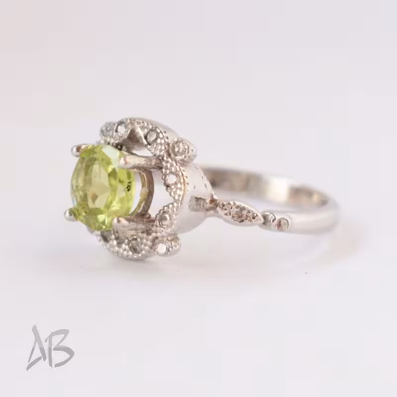 انگشتر نقره زنانه نگین زبرجد طبیعی آقابزرگ کد 608