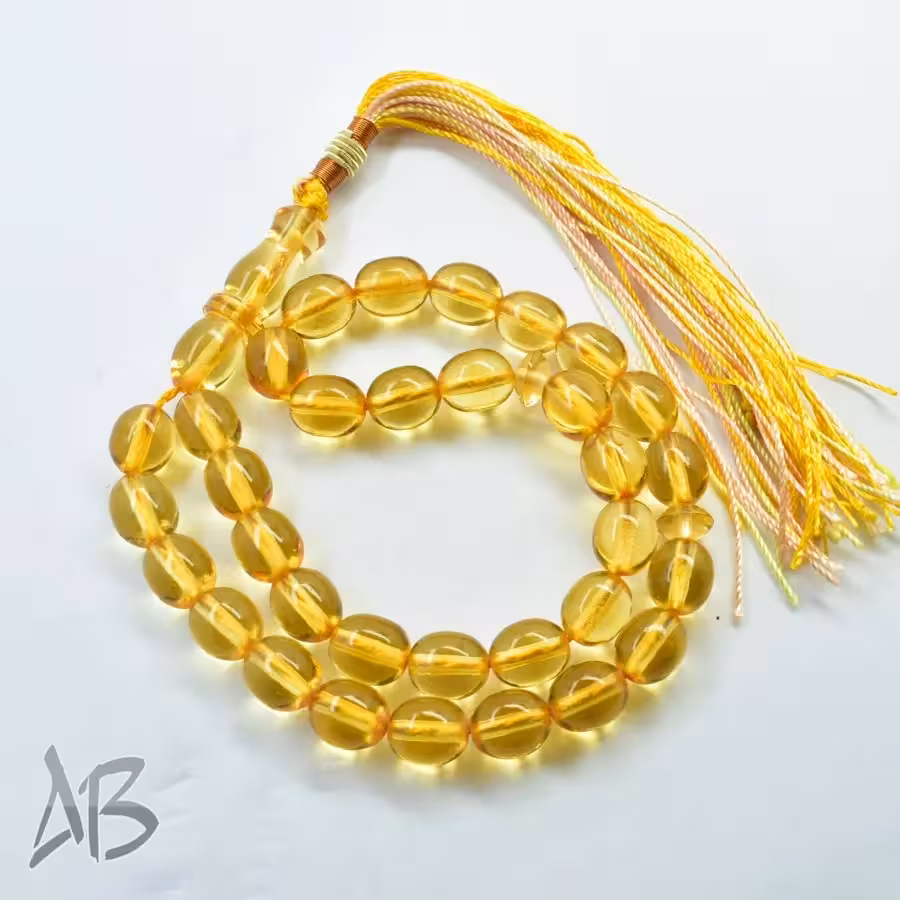 تسبیح سندلوس 33 دانه اصل بودار کد 1156 تراش تخم‌مرغی زرد شفاف آقابزرگ