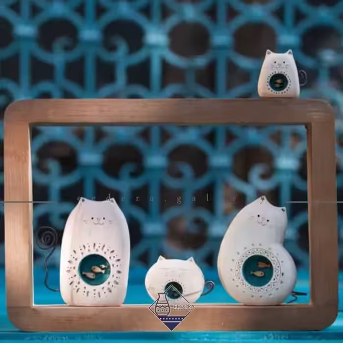 قاب دیواری گربه ماهی به دل چهار مجسمه