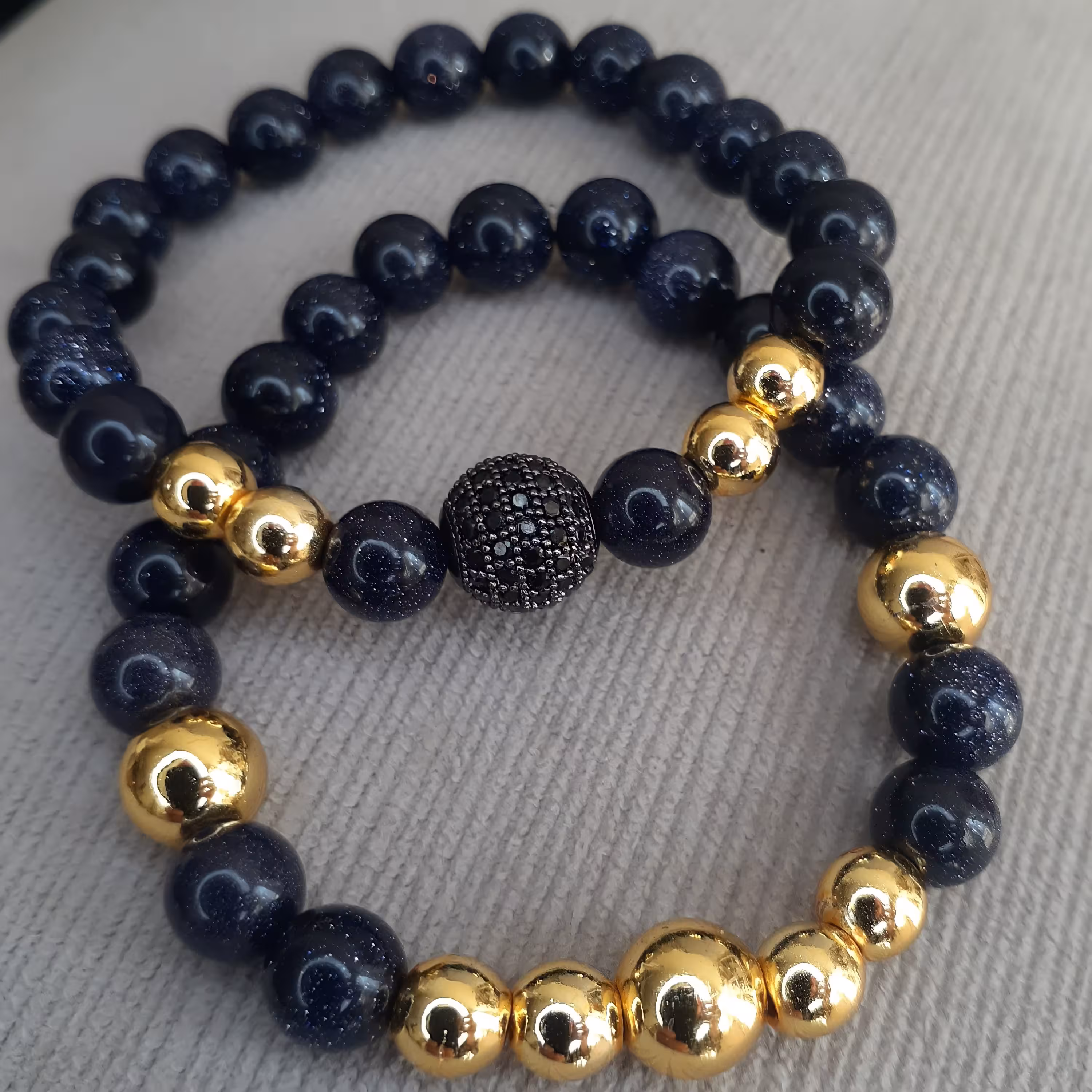 دستبند دو عددی سنگ دلربا همراه با گوی سوارسکی و حدید