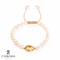 دستبند مروارید پرورشی و پلاک طلا طرح گوش ماهی