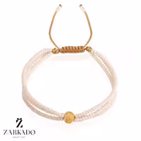 دستبند میوکی سفید سه رج و گوی طلا چکشی